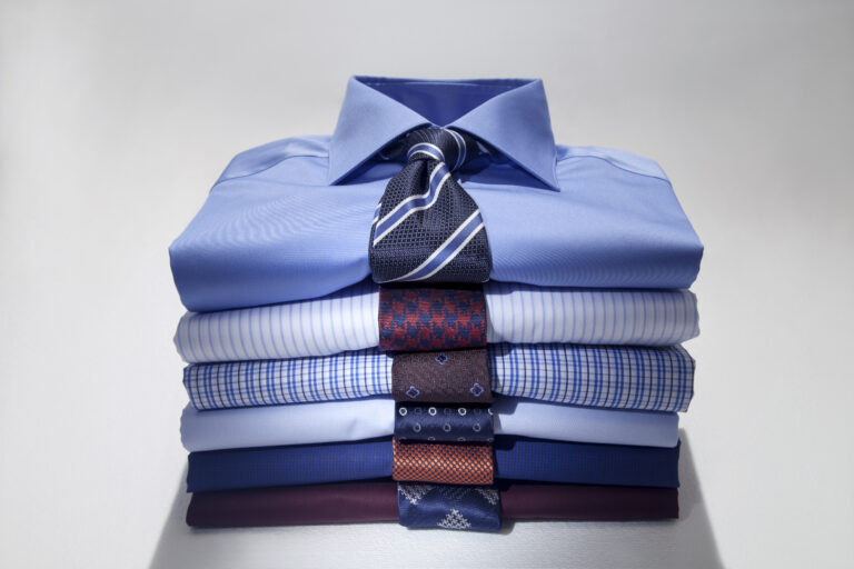 Folded,Man's,Shirts,And,Ties,Isolated,On,White,Background.